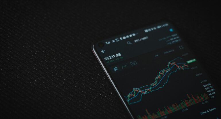 black android smartphone on black textile