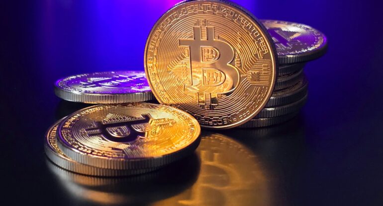 a pile of bitcoins sitting on top of a table